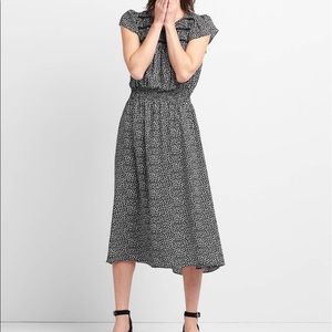 Smocked midi dress in black print